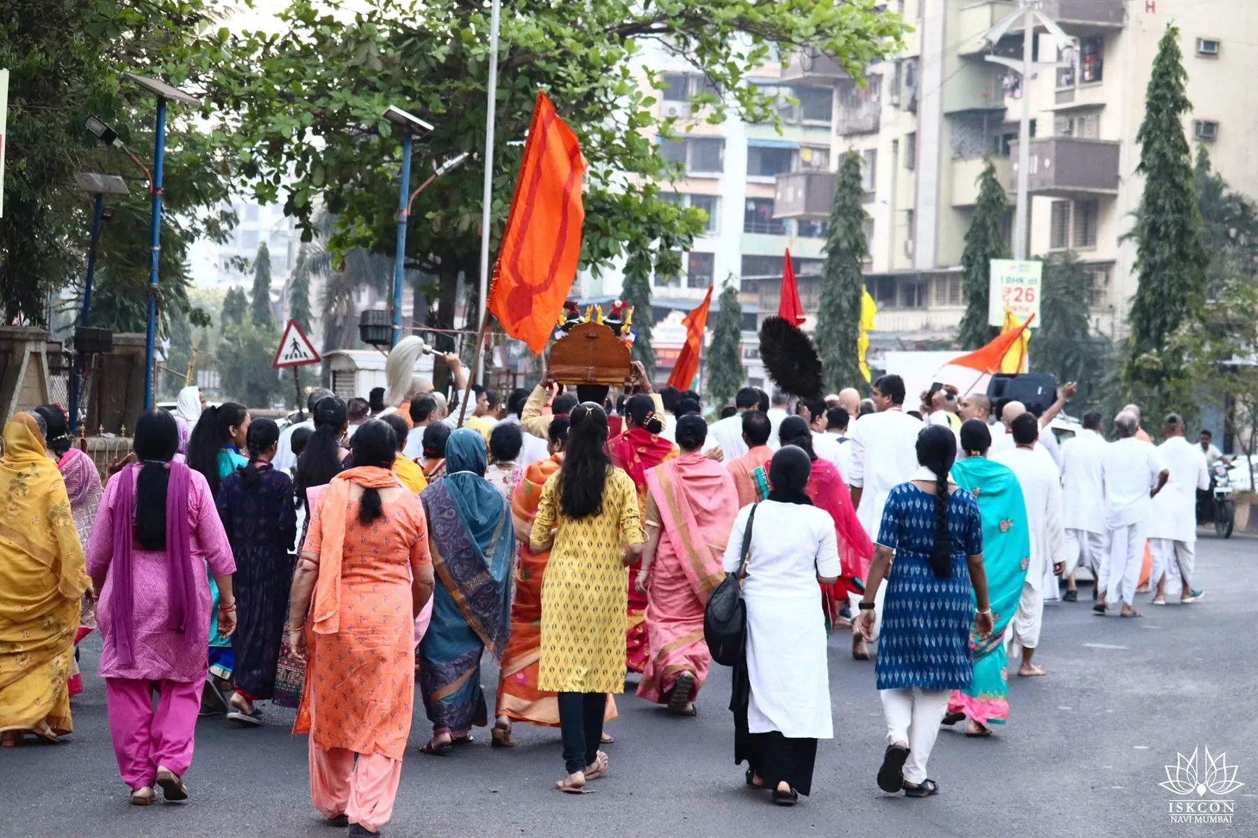 Devotees walking with the kirtan