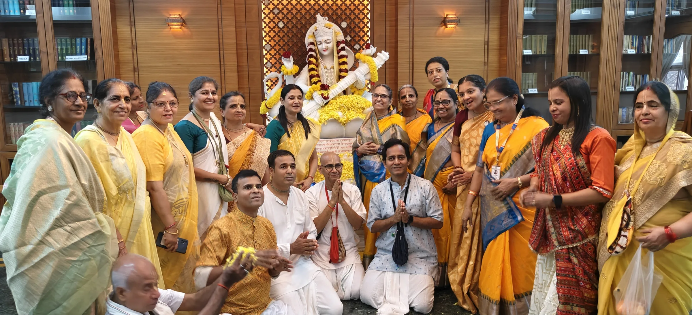 Devotees with Saraswati Devi in the temple library